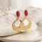 Boucles d'oreilles bohèmes rose et dorées martelées