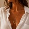 Collier long bohème chic doré à pendentif floral