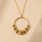 Collier long bohème chic doré à pendentif floral