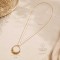 Collier long bohème chic doré à pendentif floral