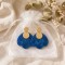 Boucles d'oreilles bohème chic bleues en résine marbrée