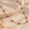Collier fin petites perles rouge doré 