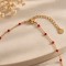 Collier fin petites perles rouge doré 